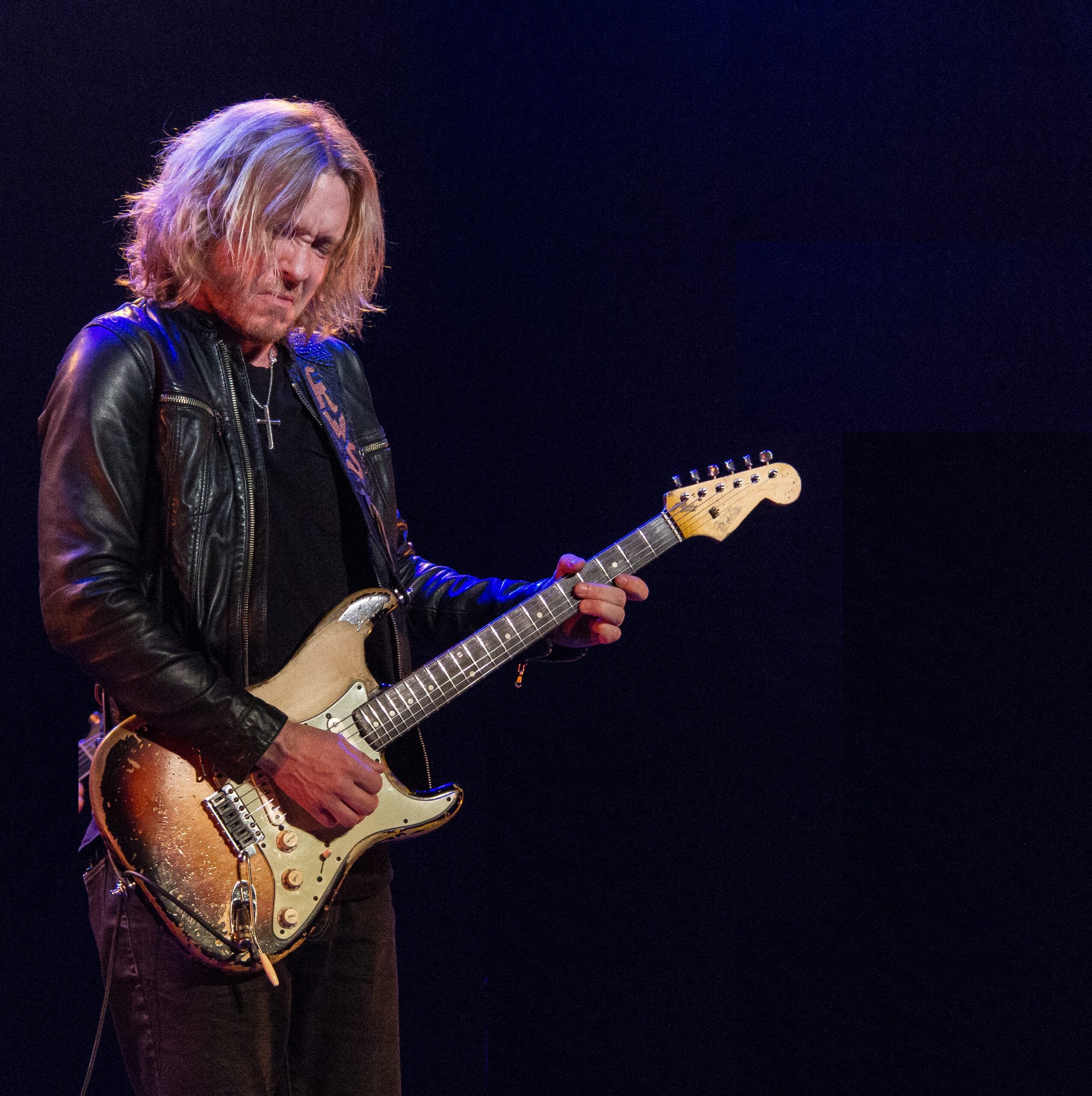 Kenny Wayne Shepherd on a stage playing guitar